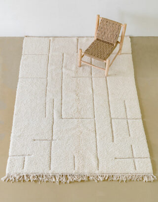 Notre tapis blanc avec ses jolies lignes asymétriques vue du haut