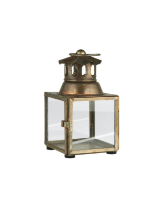 mini lanterne posée sur une table en bois